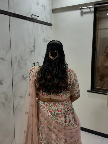 The back view of the simple and elegant half-updo, showing the beautiful curls.