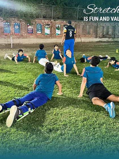 Fitness is a crucial part of our training, but we always make it fun. Group stretching and warm-ups like this are essential for preventing injuries and preparing the body for a tough session ahead.