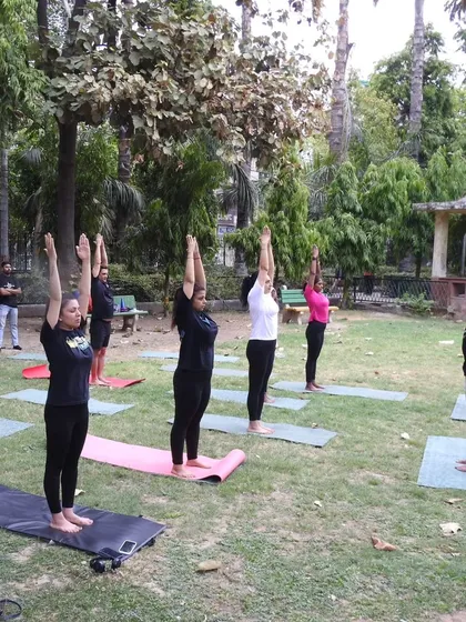 The whole community came out to celebrate yoga with us in the park. This wide shot shows our group finding their alignment together.