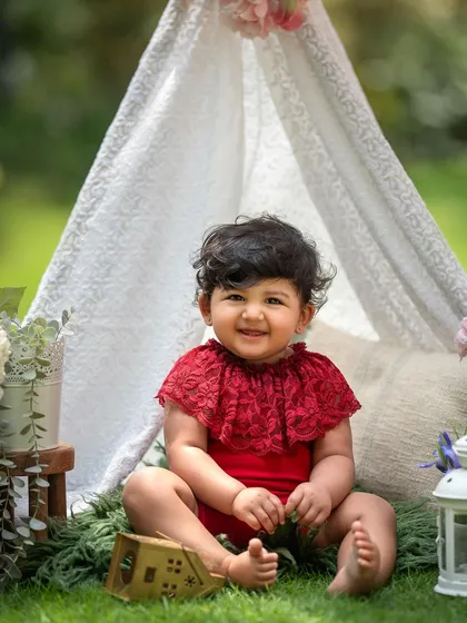 This little cutie is enjoying her outdoor teepee setup. This boho-chic theme is wonderful for a relaxed, natural vibe.