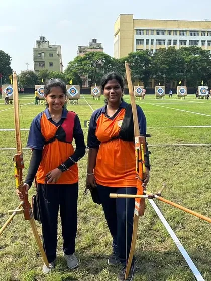 Two of our female archers ready for their event at the national competition, holding their traditional Indian bows.