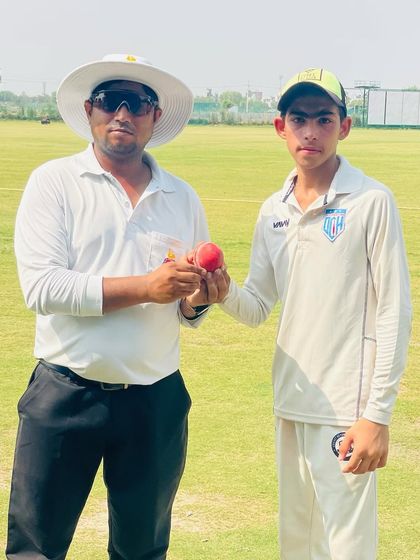 An umpire congratulating Shubham Shokeen on his 4-wicket haul. A great start to his senior career.
