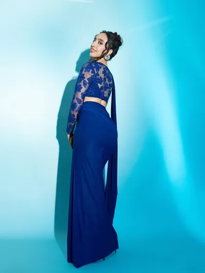 This shot from the ELLE feature highlights the back detail of the gown, showing a different angle of the fashion story.