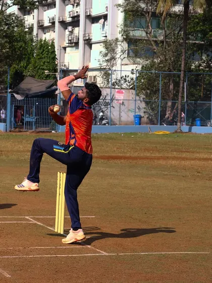 A bowler mid-delivery during our Purshottam Shield prep match, showing the dedication of our players.