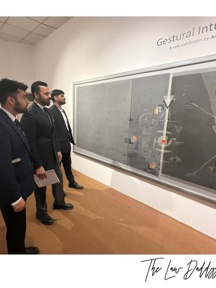 My team and I studying a piece at the "Gestural Intuitions" exhibition. Art, like law, requires careful analysis and interpretation.