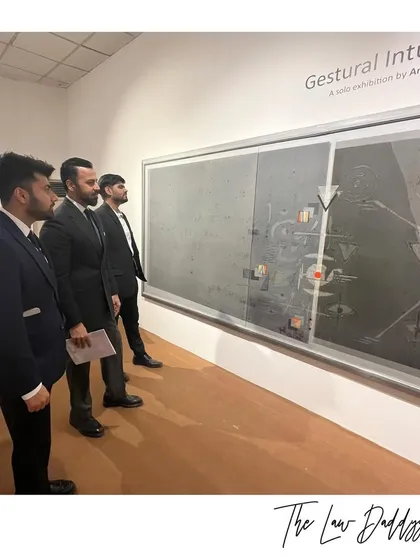 My team and I studying a piece at the "Gestural Intuitions" exhibition. Art, like law, requires careful analysis and interpretation.