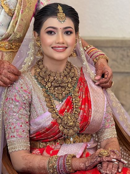 A beautiful moment between the bride and her family. The makeup is designed to look perfect in candid shots, capturing the genuine emotions of the day.