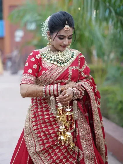 The bride adjusting her kaleere, a beautiful tradition in North Indian weddings.