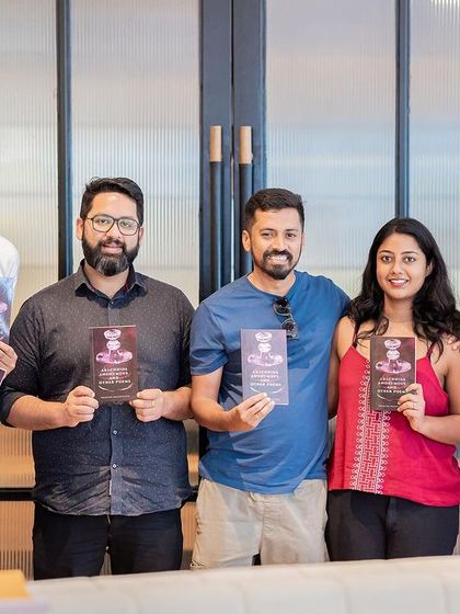 A group of friends and fellow poets proudly holding their signed copies of the newly launched book.