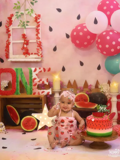 Getting delightfully messy with her watermelon cake! These are the moments I love to capture during a first birthday cake smash photoshoot.