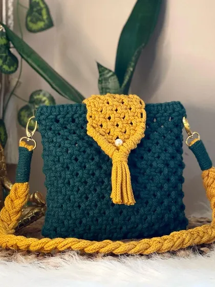 I get so much joy from playing with colors, like this bold combination of deep teal and sunny yellow. This crossbody bag features a tassel-closure flap and a thick, comfortable strap.