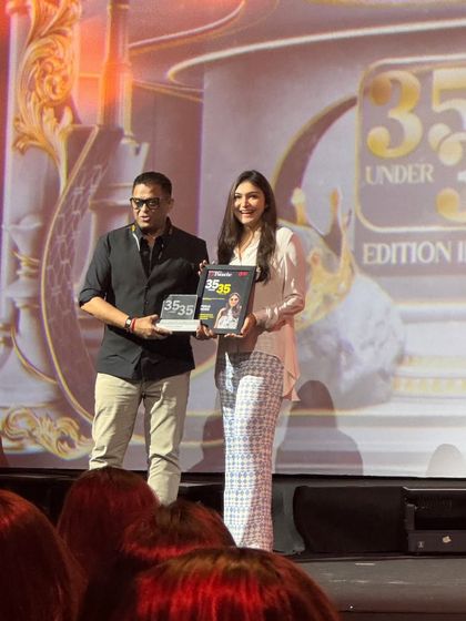 Another photo from the awards stage, capturing the happiness and pride of this achievement.