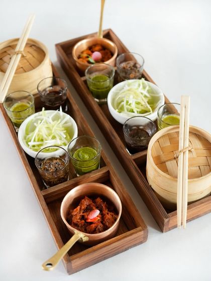 Our ghee roast soya boti is a vegetarian delight, served with roomali roti pancakes and an assortment of chutneys. It’s an interactive dish that invites you to scoop, dip, and savour the medley of flavours.