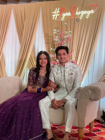 A lovely photo of the young client with her partner. Her makeup looks natural and beautiful, perfect for celebrating a special day.
