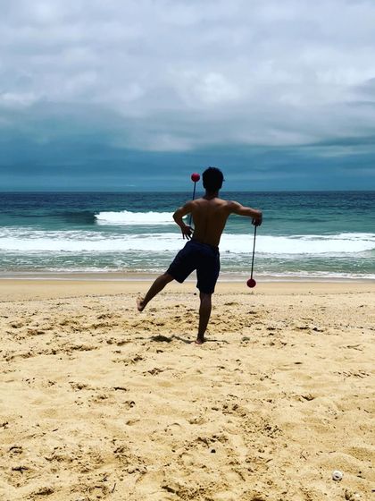 Finding my balance and flow with practice poi on the sand. The beach is the perfect place to practice without worrying about dropping your props.