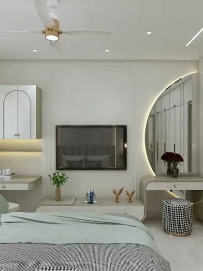 This bedroom features a multi-functional wall with an integrated TV unit, a study desk, and a beautiful arched dressing mirror with backlighting. It's a perfect example of how to maximize utility in a stylish way.