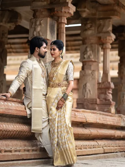 Set against the timeless grandeur of a heritage temple, this portrait is about capturing love that feels as enduring as the stone carvings around them. It's a blend of cultural elegance and a deeply personal connection.