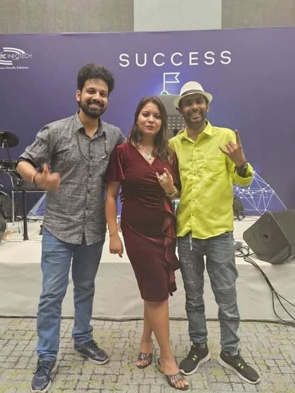 A post-gig photo on stage at the ITC Infotech event. Another successful corporate party.