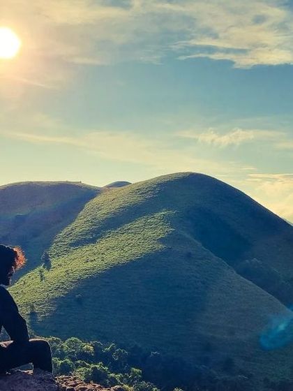 Watching the sun over the rolling hills of Mandalpatti in Coorg. We often include sunrise or sunset treks in our itineraries for these magical views.