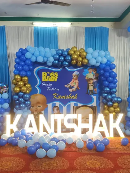 This was another fun Boss Baby themed party for Kanishak. I used a blue, gold, and white color scheme with a large balloon arch and marquee letters to create this vibrant look.