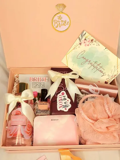 This 'Bride to Be' hamper was curated for a bride who absolutely loves pink. It’s filled with all her favorites, including a sash, perfume, wallet, and chocolates, making it a perfectly personalized gift.