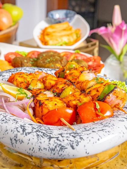 Our paneer tikka is a vegetarian favorite, featuring soft paneer marinated in spices and grilled to perfection with onions and peppers.