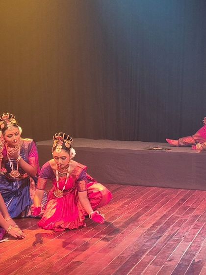 A quiet, narrative moment from the 'Krishna' performance at Jagriti Theatre, where the story is advanced through subtle gestures and expressions.