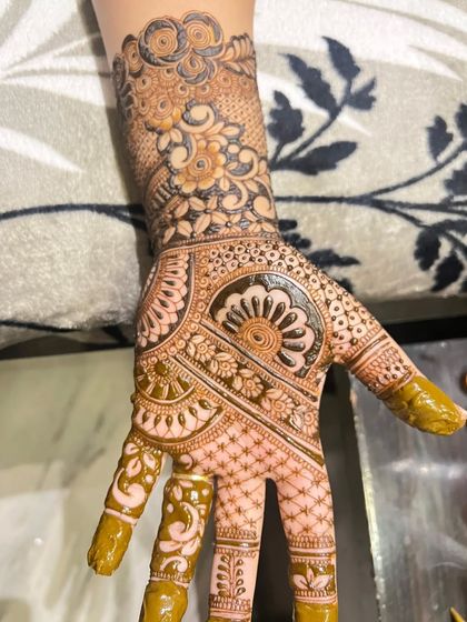 A beautiful example of a semi-filled design, where parts of the palm are left open to make the intricate floral and mandala patterns stand out more.