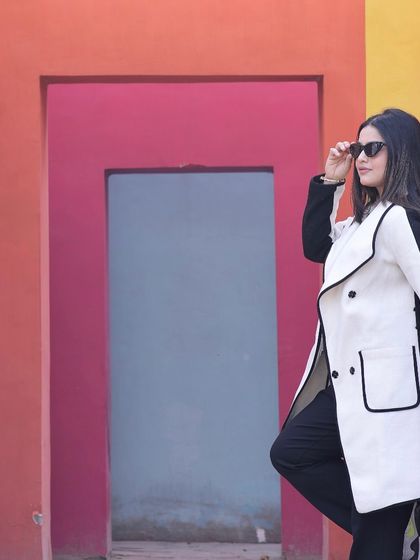 A solo shot of the bride-to-be at our colorful wall set, showcasing its potential for stunning individual portraits during a pre-wedding session.