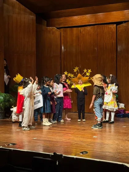 A whimsical scene from one of our plays, with students dressed as stars and storybook characters.