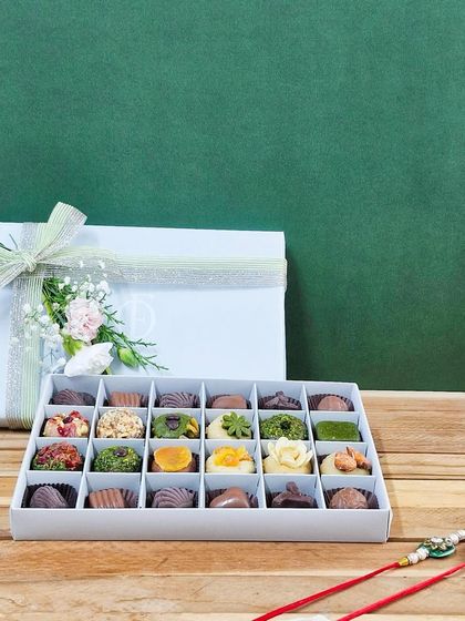 The 24-piece 'Rakhi ki Mitaas' box, beautifully presented for a grand Raksha Bandhan gesture. It's a celebration of tradition, health, and sibling love.