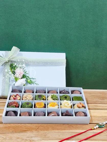 The 24-piece box, open and ready to be enjoyed. It’s a true celebration of flavor and craftsmanship, perfect for the festive occasion of Raksha Bandhan.
