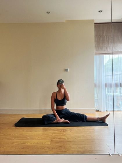 A quiet moment of stretching and reflection in my personal practice space. Flexibility and body conditioning are fundamental to a sustainable dance practice, allowing for greater freedom and expression in movement.