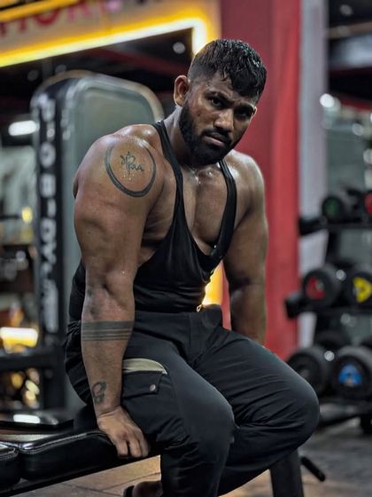 Taking a moment to sit and reflect after a tough workout. The look of determination is always there, even when I'm tired.