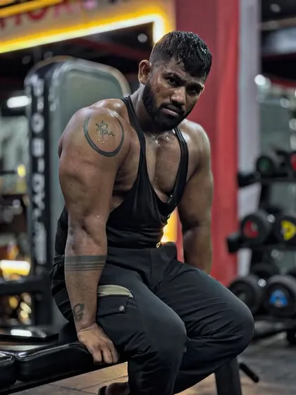 Taking a moment to sit and reflect after a tough workout. The look of determination is always there, even when I'm tired.
