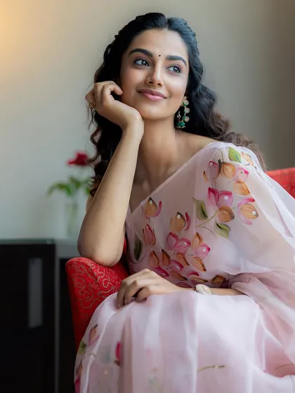 A duplicate of image 1, this shot perfectly captures the light and airy feel of the organza saree, a key part of the visual story we created for this look.