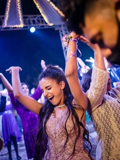 A guest enjoying the music and dancing the night away. I focus on capturing the energy of the entire party, not just the couple.