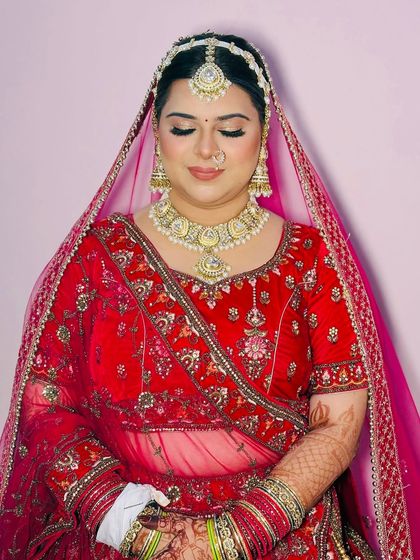 Eyes closed, this shot highlights the soft golden shimmer on the eyelids and the overall glowing complexion.