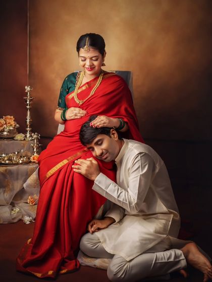 He listens for a connection with his baby. This pose is a classic for a reason, it so beautifully symbolizes the dad-to-be's bond with his unborn child.