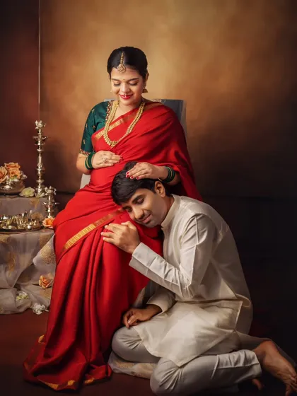 He listens for a connection with his baby. This pose is a classic for a reason, it so beautifully symbolizes the dad-to-be's bond with his unborn child.
