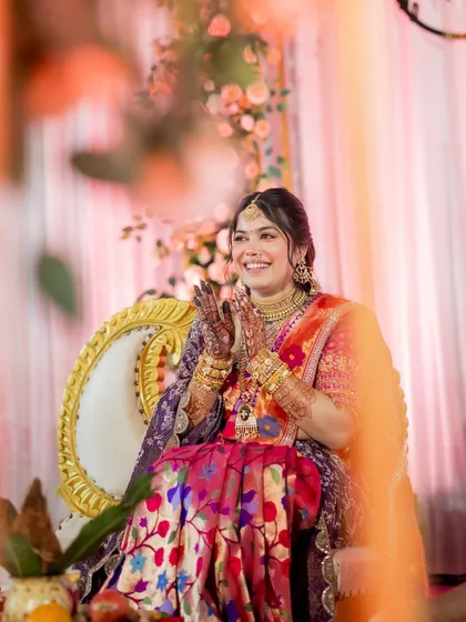 The joy of the ceremony is reflected in her smile. The makeup is designed to be radiant and long-lasting, perfect for these cherished moments.