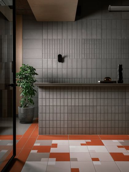 The reception area of the Trove India experience centre. I designed this space to make a strong first impression, using a textured tile wall and graphic flooring to showcase the materials the brand offers.