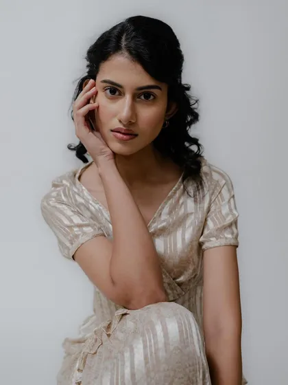 A soft and gentle portrait from a test shoot. The makeup is clean and subtle, with a focus on flawless skin and a simple, elegant open hairstyle.