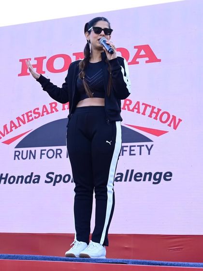Addressing the runners at the Honda Half Marathon. The theme was 'Run for Road Safety,' and I made sure to emphasize this important message.