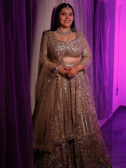 The complete look for this glamorous reception. The makeup is designed to be flawless from every angle, ensuring the bride shines brightly throughout her celebration.