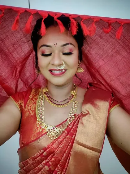 Our advanced bridal makeup course includes detailed training on regional looks, like this traditional South Indian bridal style. Students master techniques for vibrant eye makeup and learn to work with traditional attire and jewelry.