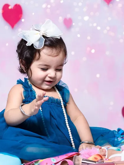 A sweet, candid smile during her fashion-themed shoot. I love capturing these in-between moments when their natural happiness shines.