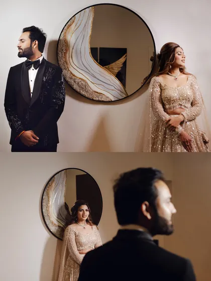 An artistic portrait of the couple using a mirror. This creative shot plays with reflections and perspective, resulting in a unique and modern engagement photo.
