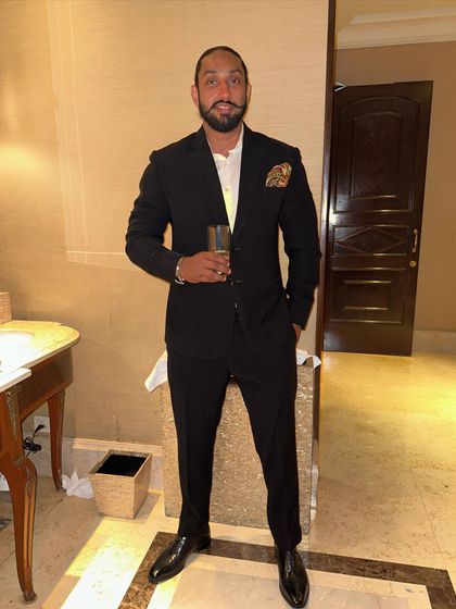 A quick pre-event photo before heading down to the console. For formal events like receptions, a sharp suit is my go-to to match the elegance of the occasion.