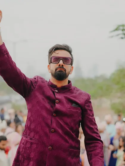 A powerful pose during the baraat procession. I bring the confidence and energy needed to lead a crowd and make the event a massive success.